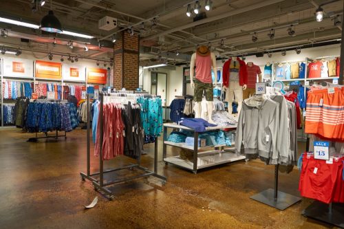 Old Navy store with clothes hanging on the wall. 