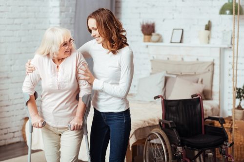 Younger Woman Helping Older Woman