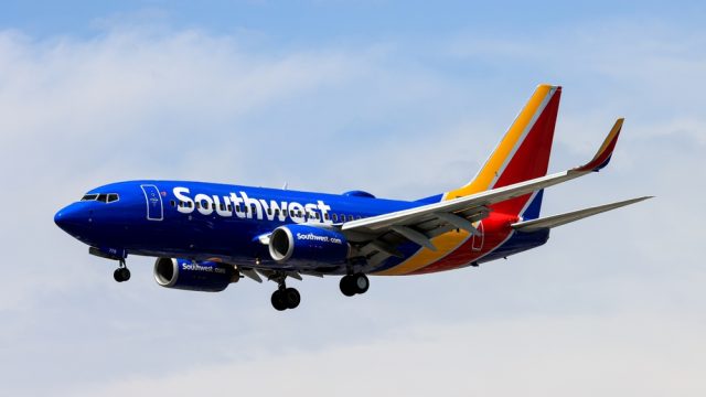 A Southwest Airlines jet landing at an airport