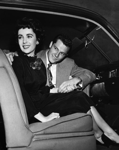 Elizabeth Taylor and Conrad Hilton Jr. in a car at the end of 1949 or early 1950