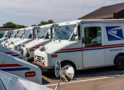 Circa August 2019: USPS Post Office Mail Trucks. The Post Office is responsible for providing mail delivery IX
