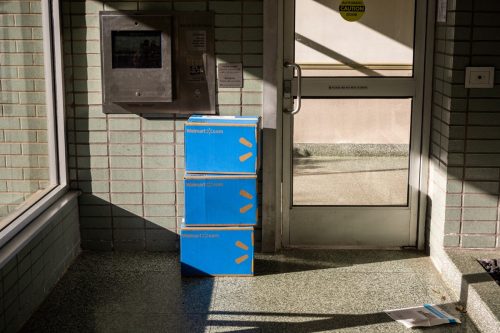 New York NY USA-June 12, 2019 Boxes laden with purchases from Walmart are left in the unsecured vestibule of an apartment building in New York