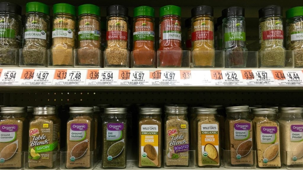 San Leandro, CA - April 08, 2016: Grocery Store shelf display with McCormick and Organic brand spices. Knowing how to use spices can greatly enhance the flavor of all your dishes.