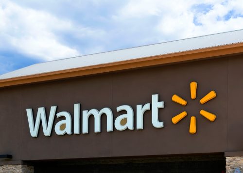 Walmart sign in storefront with brown background