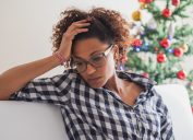 Pensive and lonely black woman during christmas celebration days
