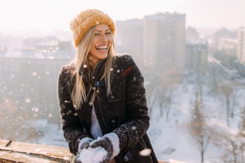 young woman embracing winter fun