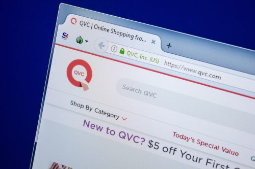 Homepage of QVC website on the display of a computer screen.