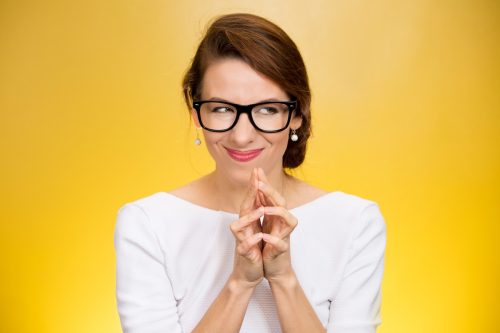 Woman out for revenge with a yellow background. 