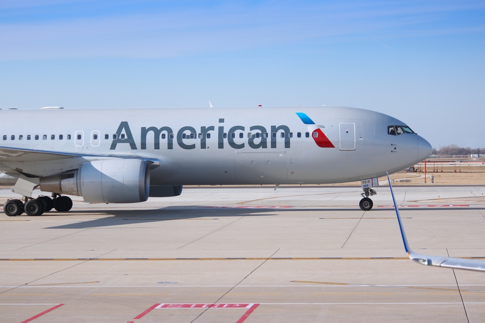 An American Airlines jet sitting on the runway
