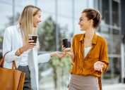 two women getting to know each other while drinking coffee
