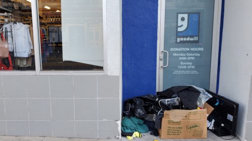 goodwill store with donations outside front
