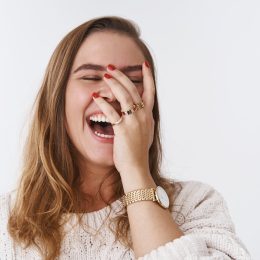 woman laughing at a funny joke