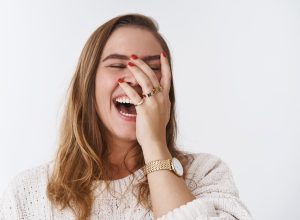 woman laughing at a funny joke