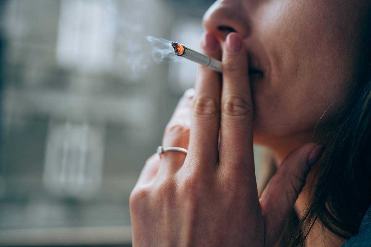 Woman smoking a cigarette.