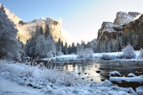 The Merced River in a snow covered Yosemite Valley.