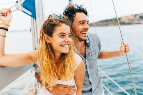 Couple enjoying their time together on a yacht.