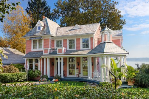 beautiful pale pink waterfront house