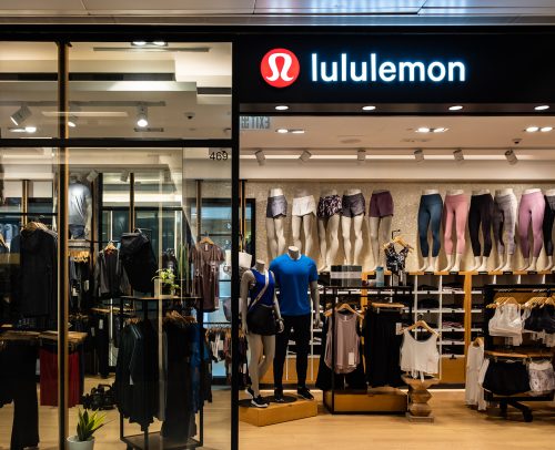 A Lululemon storefront in a shopping center