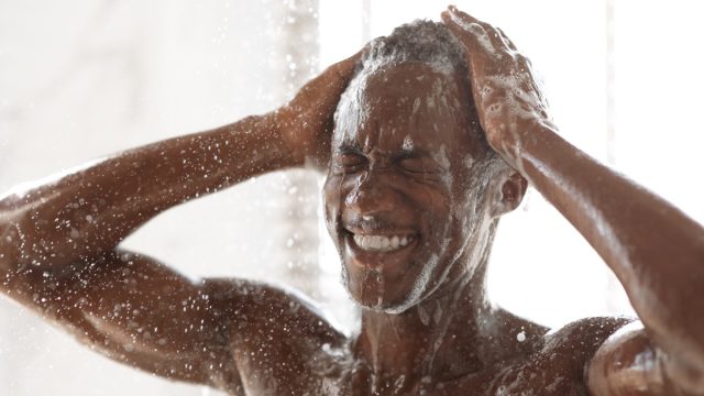 handsome Black Man Washing Head in shower