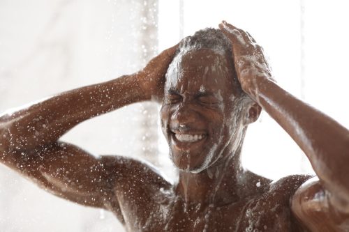 handsome Black Man Washing Head in shower