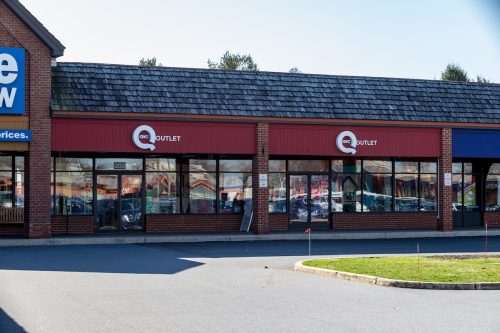 Exterior view of a QVC outlet store.