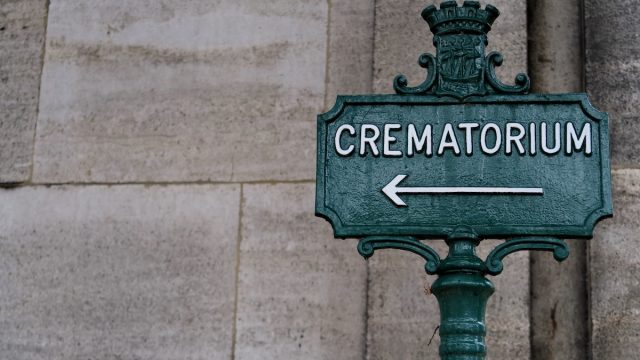 Crematorium.,Inscription,On,A,Metal,Panel.,Cemetery,Path.