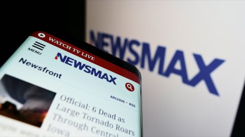 smartphone with newsmax logo
