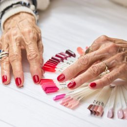 older woman selecting polish for manicure