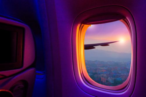 sunset view through airplane window