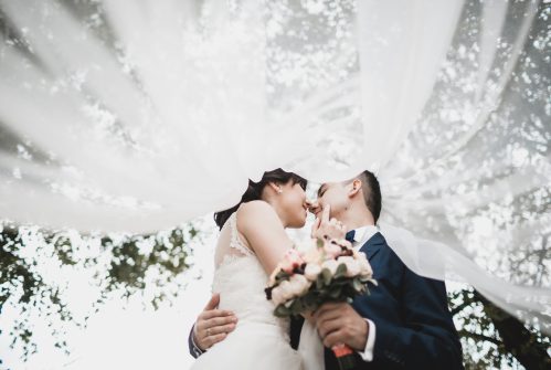 bride and groom kissing on wedding day