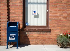 Side view of beautiful Old Brick Post office building in Hartline Washington. Blue US mail box. Small town Hartline has a population of 146. Located between Spokane and Wenatchee.