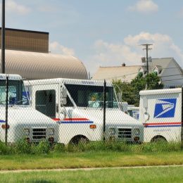 Delivery vehicles parked at the United States Post Office in downtown Rochester, Michigan. With almost 600,000 employees, the United States Postal Service is the second largest civilian employer in the United States.