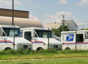 Delivery vehicles parked at the United States Post Office in downtown Rochester, Michigan. With almost 600,000 employees, the United States Postal Service is the second largest civilian employer in the United States.