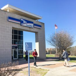 Entrance of USPS store with customers. The United States Postal Service is an independent agency of US federal government for providing postal service national wide