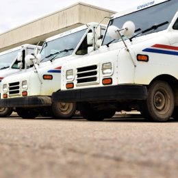 Tecumseh, Michigan, USA, November 20, 2021 U.S. Postal Service trucks in a line at Post Office before beginning mail deliveries.