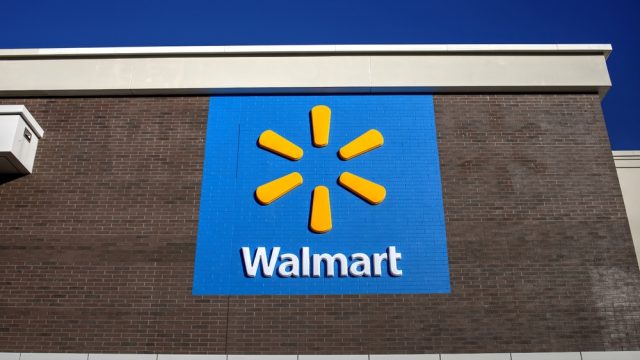 A Walmart logo on the side of a store location