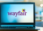 A laptop with the Wayfair logo on the screen