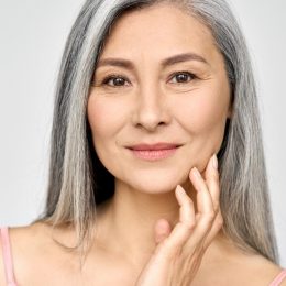 Closeup portrait of gorgeous middle aged mature asian woman with gray hair