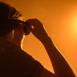 A woman using special glasses to watch a solar eclipse