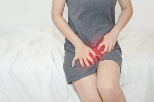 woman itching from a yeast infection