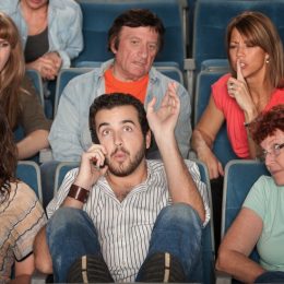 Person on the Phone at the Movies