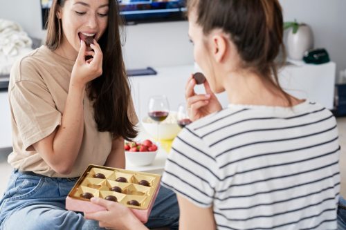 Two Women Eating Chocolates