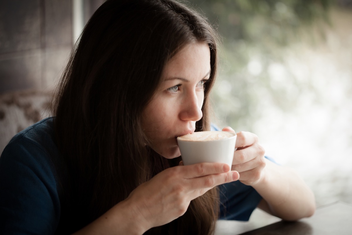 Young Woman Drinking Coffee