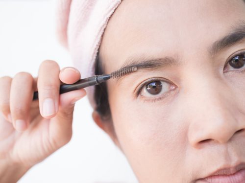 close up woman filling in eyebrows | MercerOnline