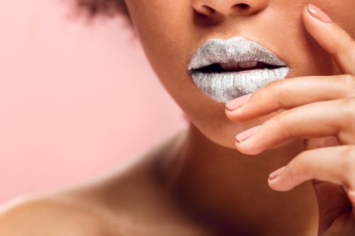 Close up of a woman wearing silver lipstick
