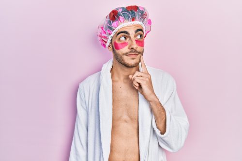 man wearing a shower cap and eye masks