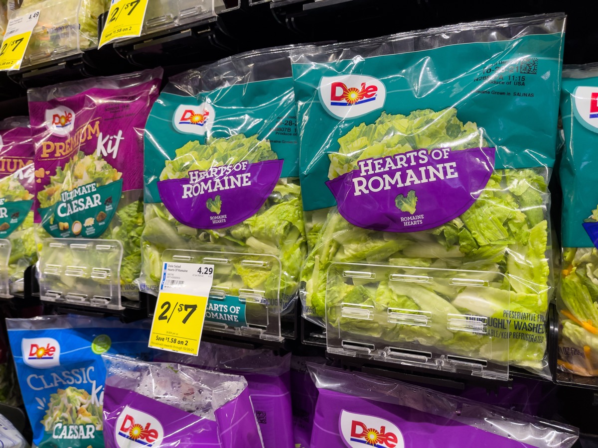Dole bagged romaine salad lettuce on display at local grocery store.