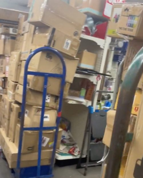 TikTok video still showing boxes blocking store shelves in Dollar Tree