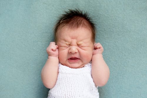 close-up of newborn baby crying