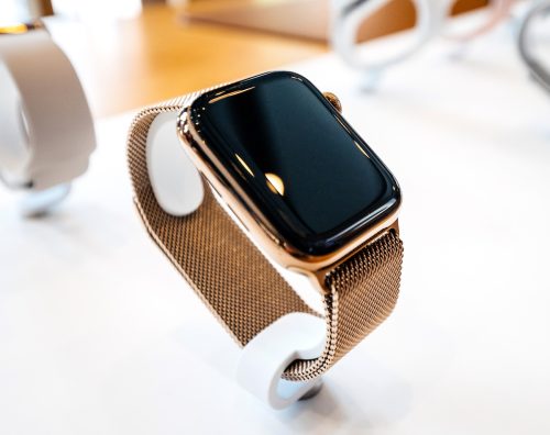 Gold apple watch with gold band on display at a store